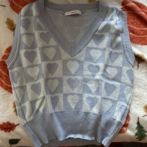 Blue and white vest with hearts